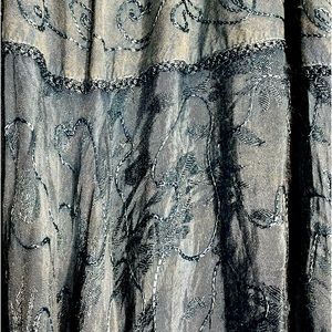 Just Cruising brand. Beautiful blue skirt with detailed stitching on it.